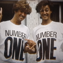 Wham! members George Michael and Andrew Ridgeley wearing NUMBER ONE tshirts in archival photo