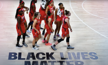 Atlanta Dream with "Black Lives Matter" written on the court.