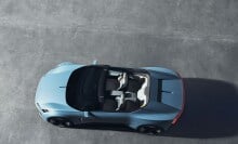 Looking from above down to an opened baby blue convertible.