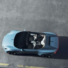 Looking from above down to an opened baby blue convertible.