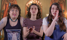 From left to right: Mashable staff Kristy Ouchko, Belen Edwards, and Lily Kartiganer smile and gesticulate against a 'Bridgerton' interior shot