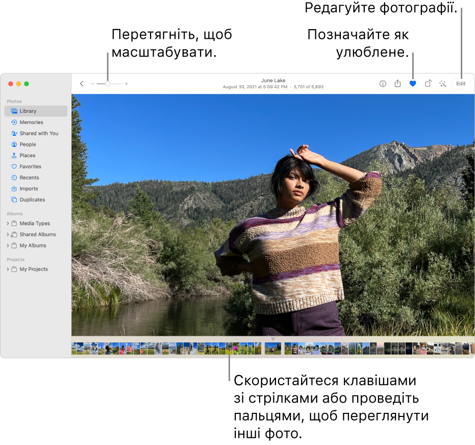 Вікно програми «Фотографії» зі збільшеним фото справа з рядком мініатюр нижче. Панель інструментів угорі містить повзунок «Масштаб», кнопку «Улюблене» та кнопку редагування.