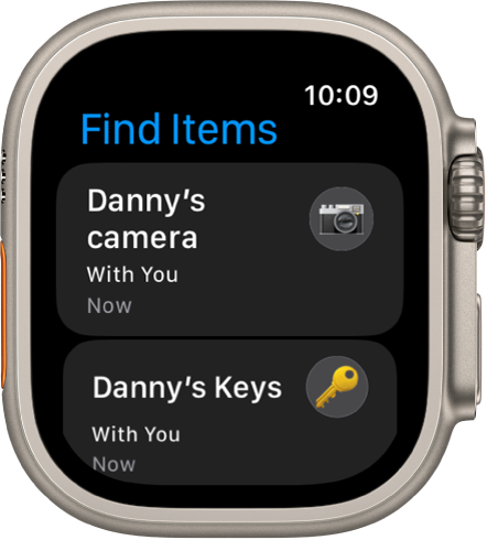 The Find Items app shows that the AirTags attached to a camera and set of keys are with you.