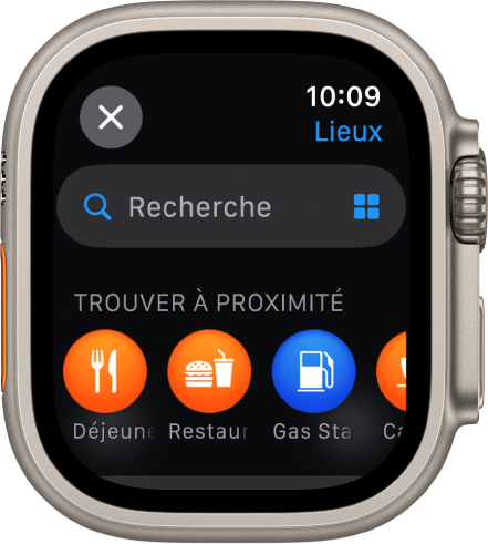 L’écran Rechercher dans l’app Plans, avec le champ de recherche en haut de l’écran. Un en-tête Rechercher à proximité apparaît vers le bas avec en dessous des catégories telles que Déjeuner et Stations essence.