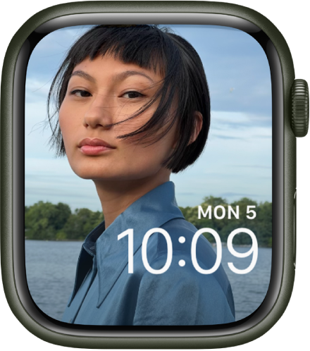 The Photos watch face shows a photo from your synced photo album. The date and time is near the bottom right.