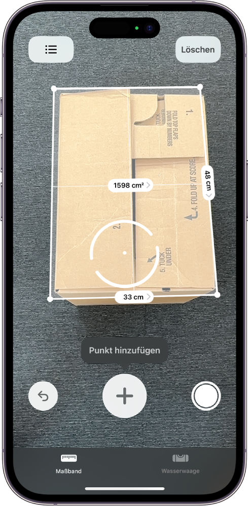 Ein Bildschirm, der die Messung der Abmessungen einer Box in der App „Maßband“ zeigt. Die Fläche der Box wird auf der Basis ihrer gemessenen Abmessungen berechnet.