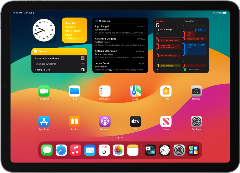 The iPad Home Screen with Dark Mode on.