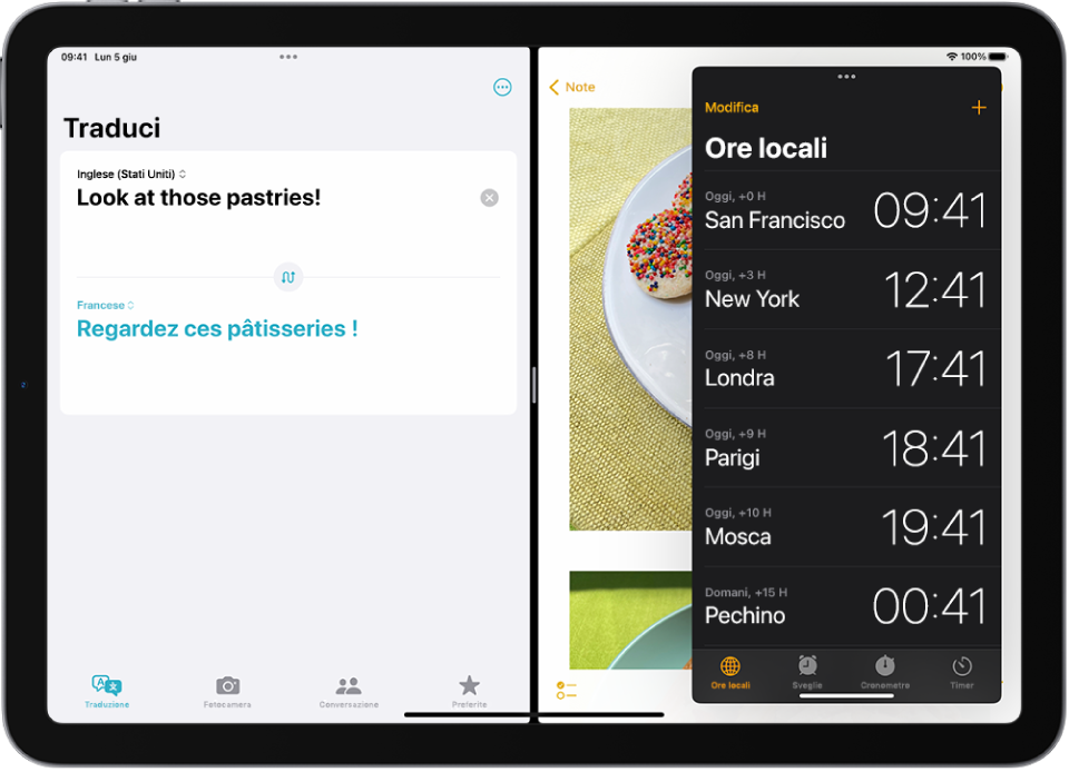 L’app Traduci è aperta sul lato sinistro dello schermo, Note è aperta sulla destra e Orologio è aperta in una finestra Slide Over che copre in parte Note.