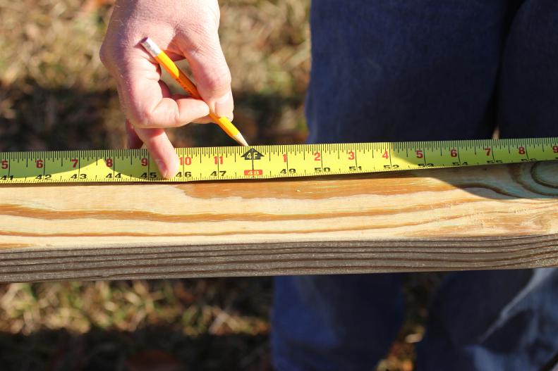 What you’ll need: 250’ 2x4 pressure-treated lumber/ 8’ 2x2 pressure-treated lumber/ 20’ 1”x1-3/4” pressure-treated lumber/ 1”x4-1/2”x33-1/2” pressure-treated lumber/ 112” 1x6 pressure-treated lumber/ 84” 1x1 pressure-treated lumber/ 15’ 3/4”x3/4” pressure-treated lumber/ 19’ 5/4x6 deck boards/ 5/8”x4’x6’ plywood/ 92” 1/4”x 1-1/2” lattice strips/ 260’ 1x4 appearance boards/ 1 roll 4’x50’ hardware cloth/ 5 26”x96” ribbed roof panels/ 5 4’x8’ siding panels/ 1 20”x33” single hung window/ 1 36” screen door/ 1 box 3/8” galvanized staples/ 1 box roofing screws/ 1 box 2” exterior screws/ 1 box 2” finishing nails/8 3” T hinges/ 3 door pulls/ miter saw/ jigsaw/ drill with screwdriver bit/ hammer/ level/ measuring tape/ square/ staple gun. &nbsp;Before assembling the frame for your chicken coop and enclosed run, measure and cut the necessary lumber as shown in the&nbsp;<a href="http://cdn.hgtvgardens.com/ad/ec/84acd6f4447f8c1ca102238f6218/chicken-coop-plans.pdf" target="_blank">detailed plans</a>. Select pressure-treated pine, cedar or other lumber appropriate for outdoor projects. Whether you have purchased ten or twelve-foot planks, calculating cuts in advance will minimize waste.