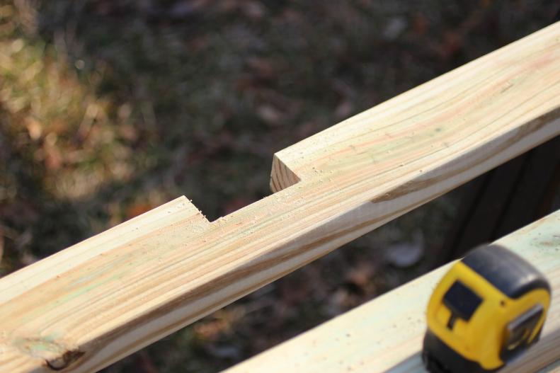 Use a jigsaw to cut marked notches. Notching frame junctions ensures the position will be accurate and provides a level framework to which the fencing may be attached.