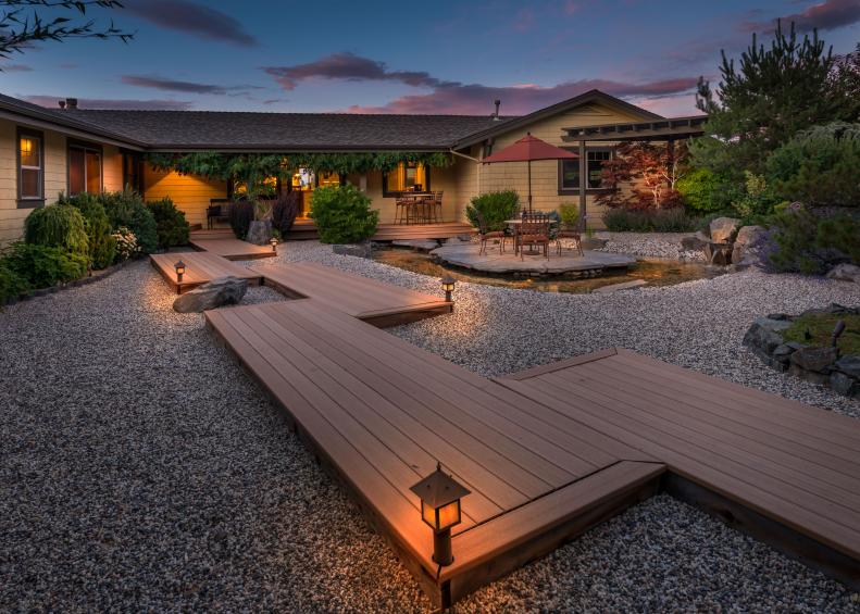 Backyard With Deck Walkway and Gravel Landscaping