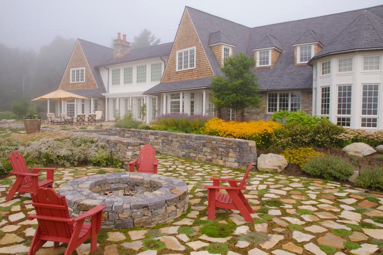 Rustic Backyard with Fire Pit, Stone Pavers and Masonry Wall