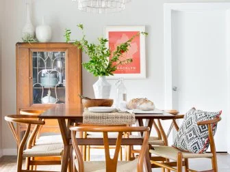 Midcentury Modern Dining Room With Tiered Chandelier