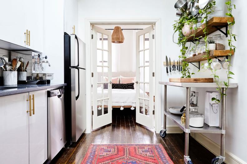 The skylit kitchen has French doors that open into the master bedroom. The doors add an unexpected architectural detail and create a nice transition from one room to the next. 