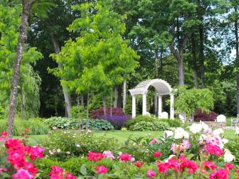 formal garden with white arbor