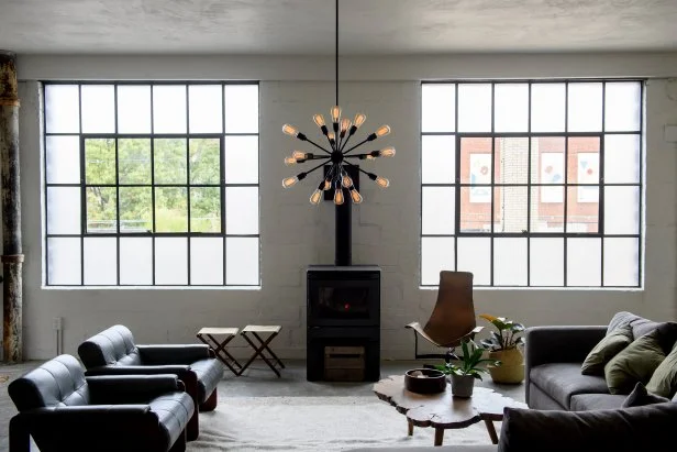 Black and White Living Room with Black Armchairs and Gray Sectional 