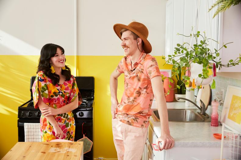 Sam Ushiro and Kyle Larsen Stand in Their White Kitchenette