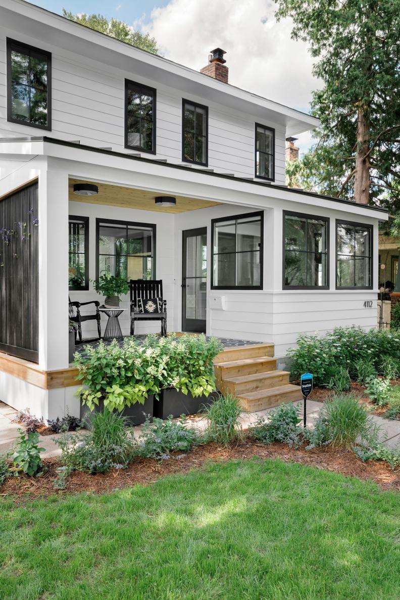 Exterior View of White Modern Farmhouse With Black-Framed Windows