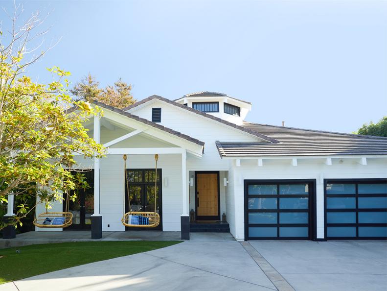 “Believe it or not, Ant and I had a photo of a home that looked just like this one on our vision board before we found this house,” says Christina. The couple hung swings from Serena & Lily on the front patio, one of the kids’ favorite spots. 