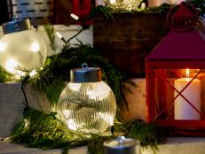 Oversized Glowing Christmas Ornaments on Stairs