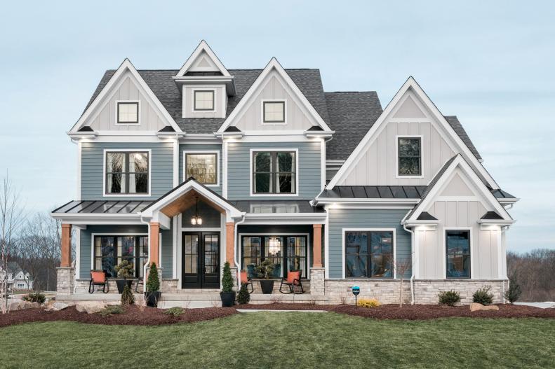 Blue-and-White Craftsman Home Features Multiple Gable Dormers