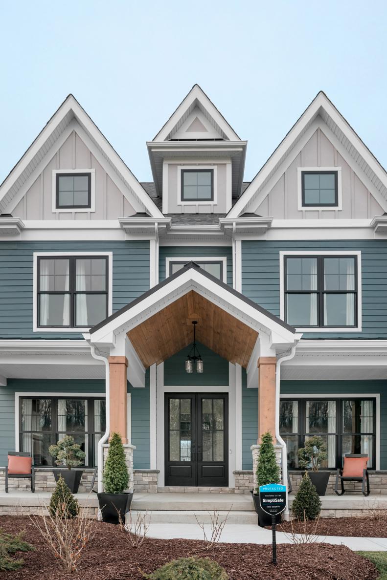 Black-Framed Windows Make Blue-and-White Craftsman House Stand Out