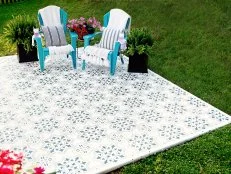 Transform your drab patio into a bright, beautiful outdoor oasis with this easy stenciling project inspired by colorful Mediterranean tile.