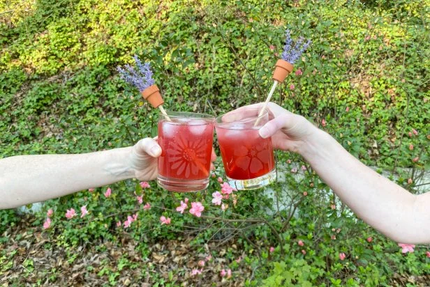 Make a Lavender Collins by adding 1-1/2 ounces of gin, 3/4 ounces fresh lemon juice, 1/2 ounces lavender and blackberry simple syrup and 3 ounces of club soda. Top with ice and garnish with lavender sprigs.