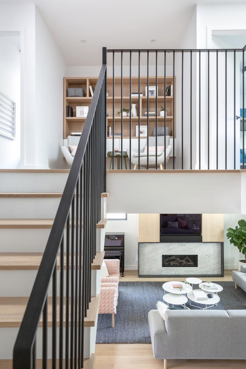 A stairwell shot of the upstairs and downstairs living areas of a home