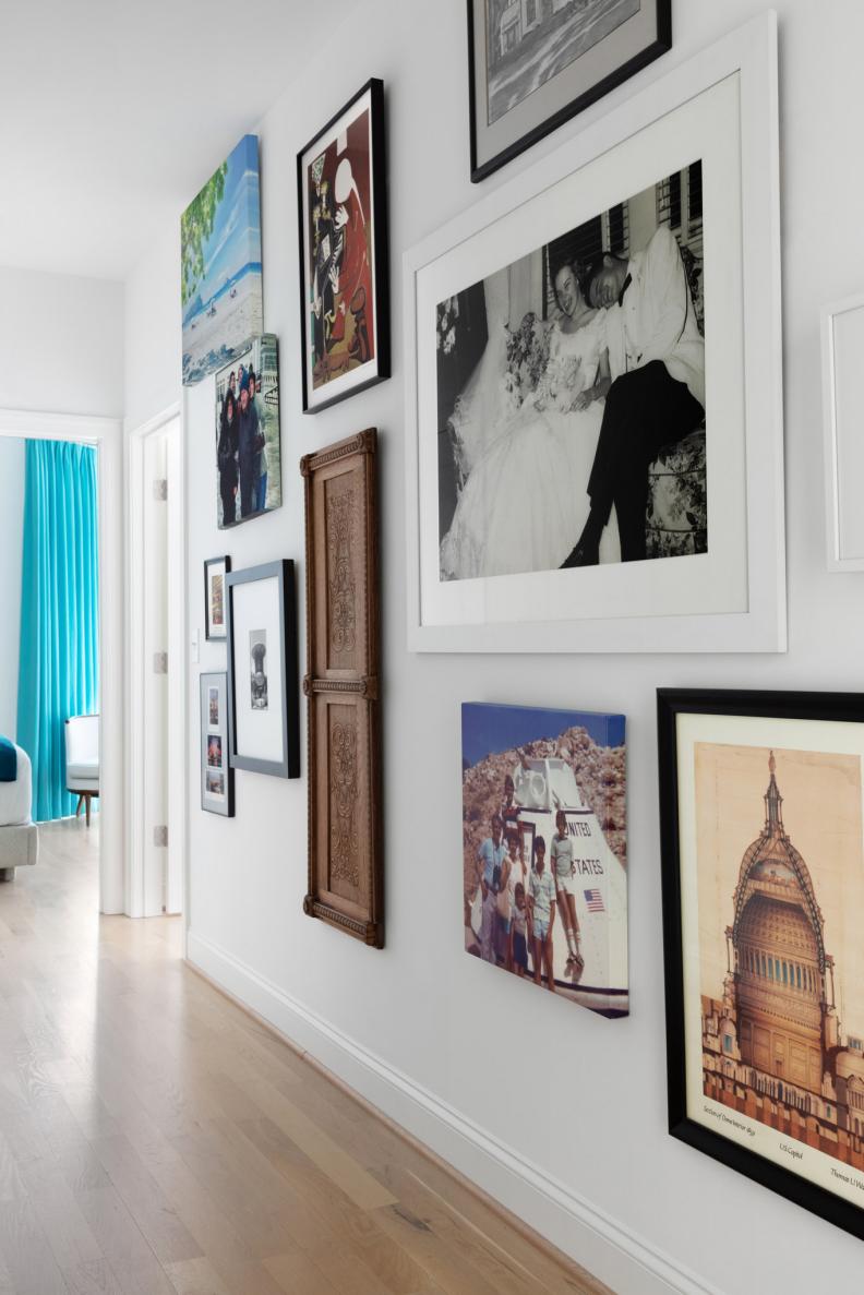 Coastal Hall Leading to Bedroom Featuring Artwork and Photographs