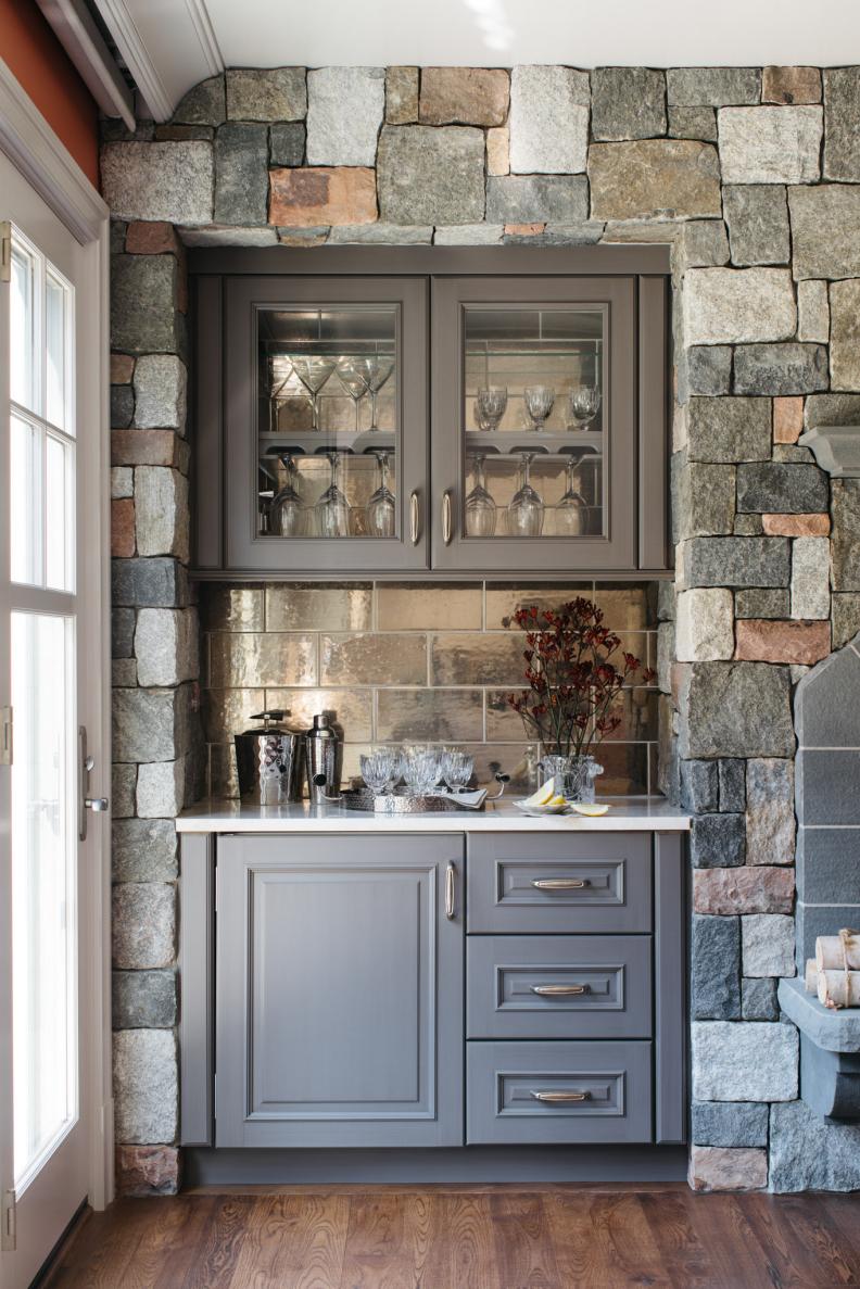 Built-In Bar Features a Metallic Backsplash