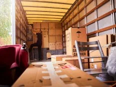 Removal company helping a family move out of their old home