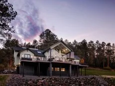 Exterior photography of 2023 HGTV Dream Home in Morrison, Colorado. Photography of Belgard Hardscape products and Trex composite decking and railing.