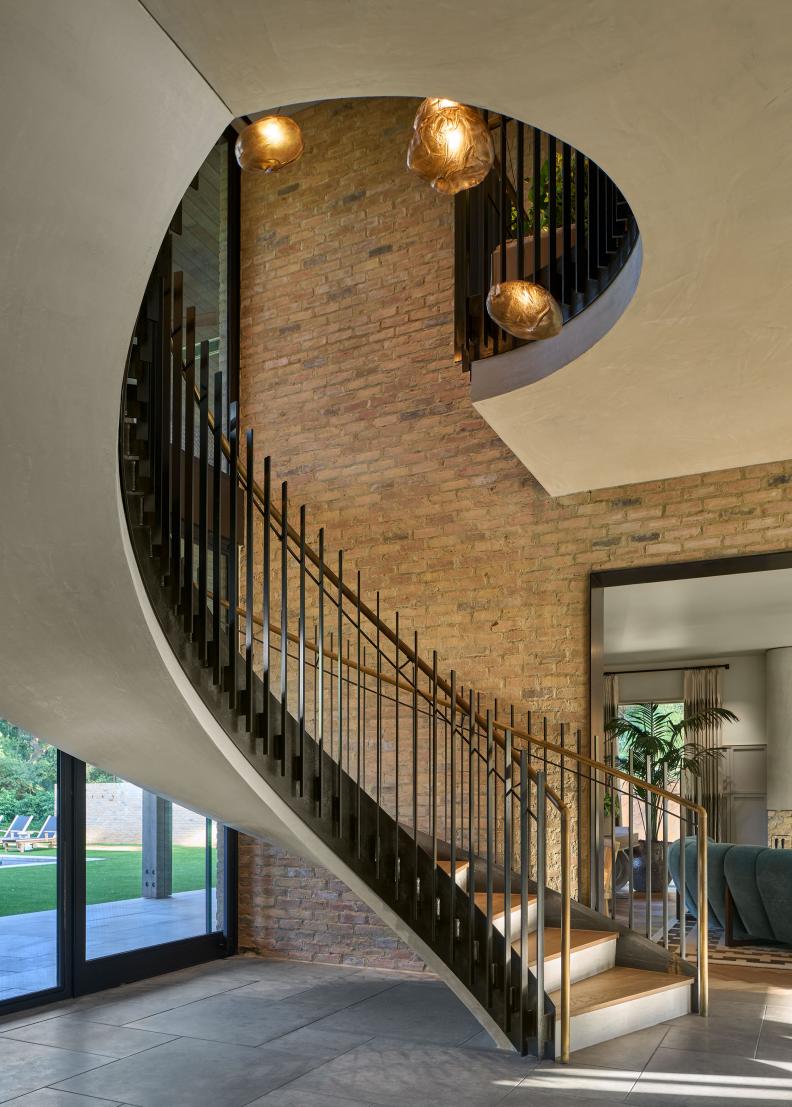 Curved Staircase in Neutral Midcentury-Modern Living Space