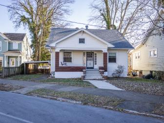 Before images of the front exterior of the house as seen on HGTV's Urban Oasis 2023 Giveaway Home located in Kentucky.