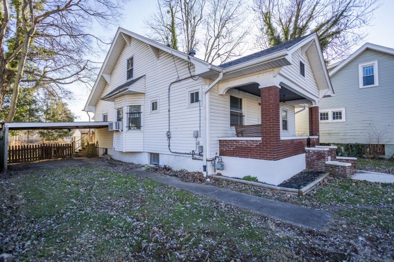 Before images of the front exterior of the house as seen on HGTV's Urban Oasis 2023 Giveaway Home located in Kentucky.