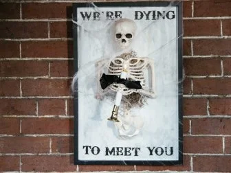 Skeleton Welcome Sign for Halloween that says "Dying" to Meet You