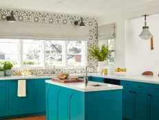 Teal Kitchen With a Patterned Gray Backsplash