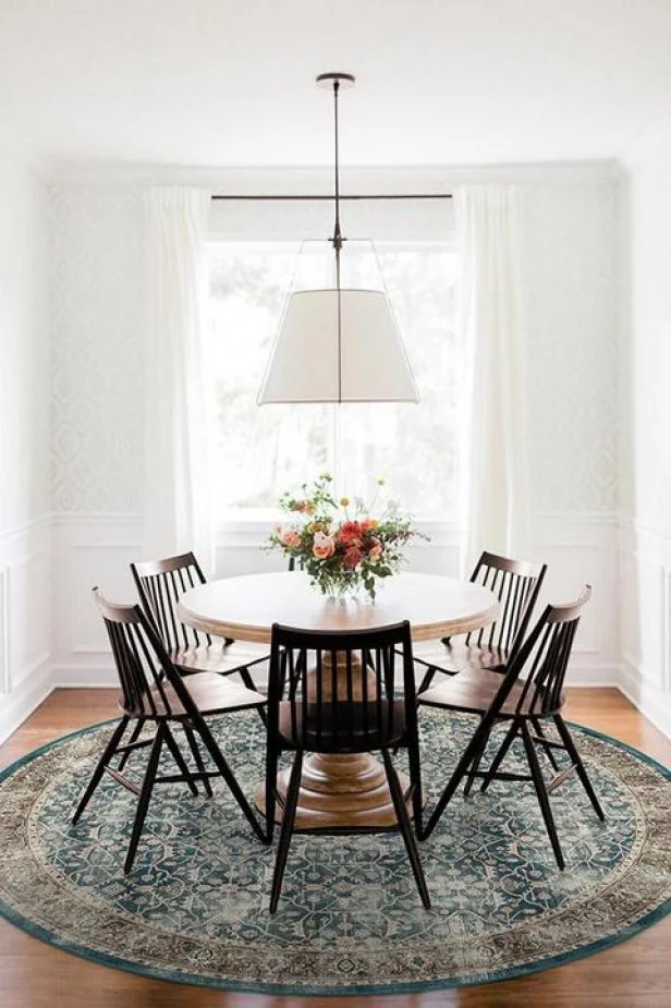 Tastefully designed dining room with vibrant bouquet of flowers as the center piece