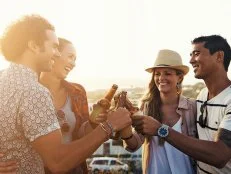 Shot of a group of friends having drinks while out on a picnicimage806209.jpg