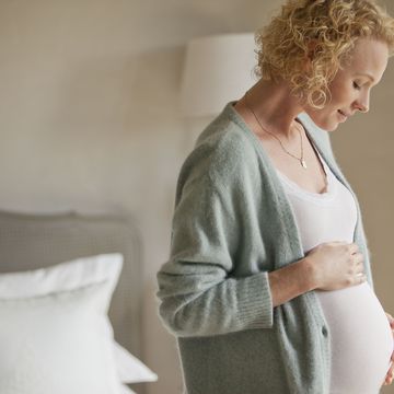 pregnant woman holding baby bump