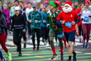 runners in the jingle all the way race dressed in santa costumes