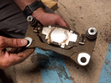 front brake pads being replaced