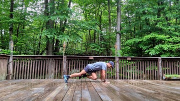 a man lying on a wooden deck