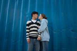 a man and woman kissing