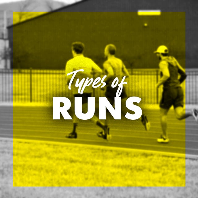 a group of men in sports uniforms running on a field