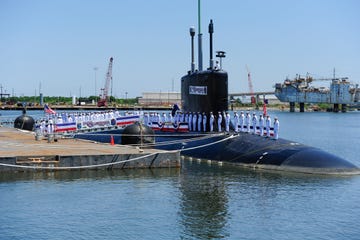 120602 n wl435 655pascagoula, miss june 2, 2012 sailors assigned to the virginia class attack submarine uss mississippi ssn 782 man the ship during the commissioning ceremony for the navy's ninth virginia class attack submarine us navy photo by mass communication specialist 1st class peter d lawlorreleased