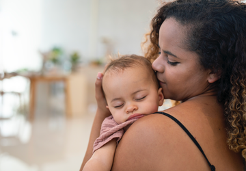 woman cradles baby