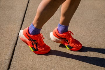 a person wearing red shoes