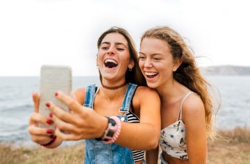 friends taking selfie on the beach